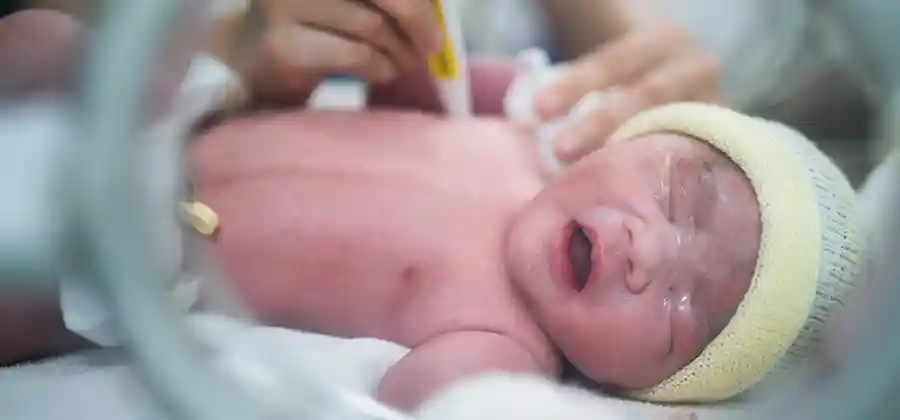 Newborn in hospital NICU representing the perinatal period when cerebral palsy brain damage most often occurs
