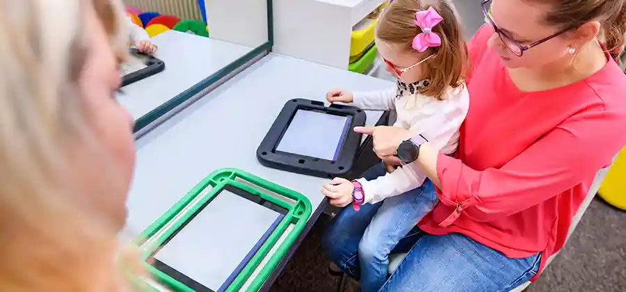 Child with cerebral palsy participating in classroom activities