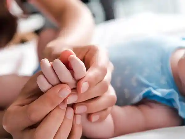 Family meeting with a care team to plan treatment after receiving a cerebral palsy diagnosis for their child