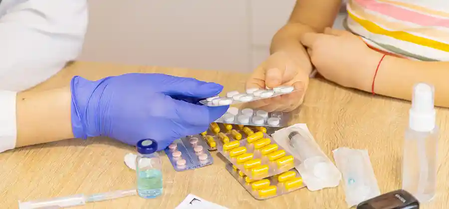 Child with cerebral palsy receiving medication management consultation with a pediatric neurologist