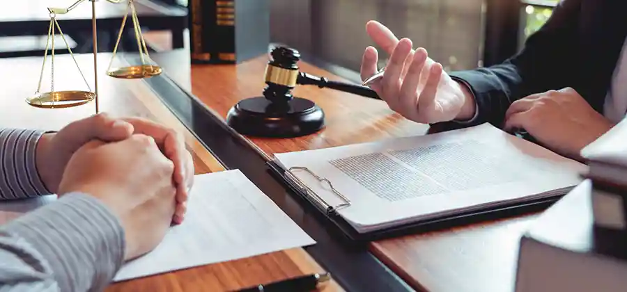 Birth injury lawyer reviewing medical records for an Erb's palsy case caused by medical negligence during delivery