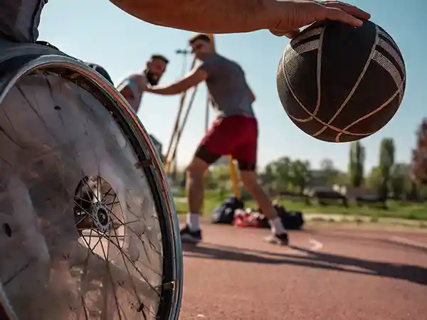 Child with cerebral palsy participating in adaptive sports recreational therapy program