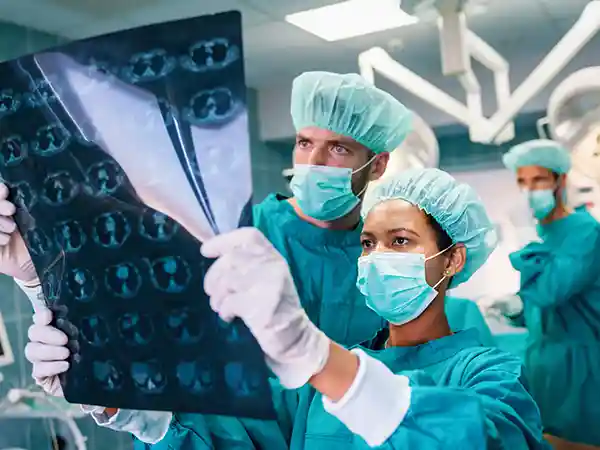 Illustration of selective dorsal rhizotomy (SDR) neurosurgery for cerebral palsy spasticity reduction
