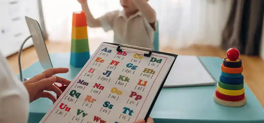 Child with cerebral palsy working with a speech-language pathologist on communication and oral motor skills