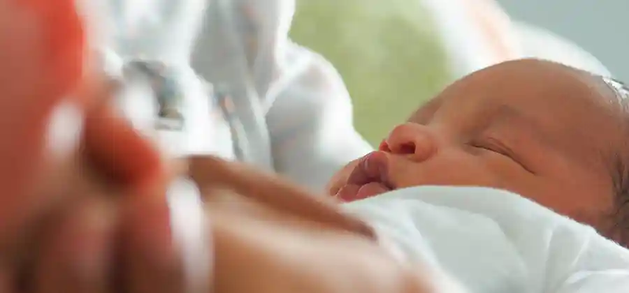 Newborn in hospital setting representing the range of birth injuries that can occur during labor and delivery